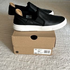 UGG women’s slip-on black leather shoe, US size 8.5